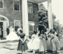 Bride Nancy Sutcliffe throws the bouquet from the porch of her home, Hearthside, during her 1949 wedding  PHOTO: Hearthside House